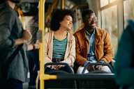 Couple travelling on the bus.